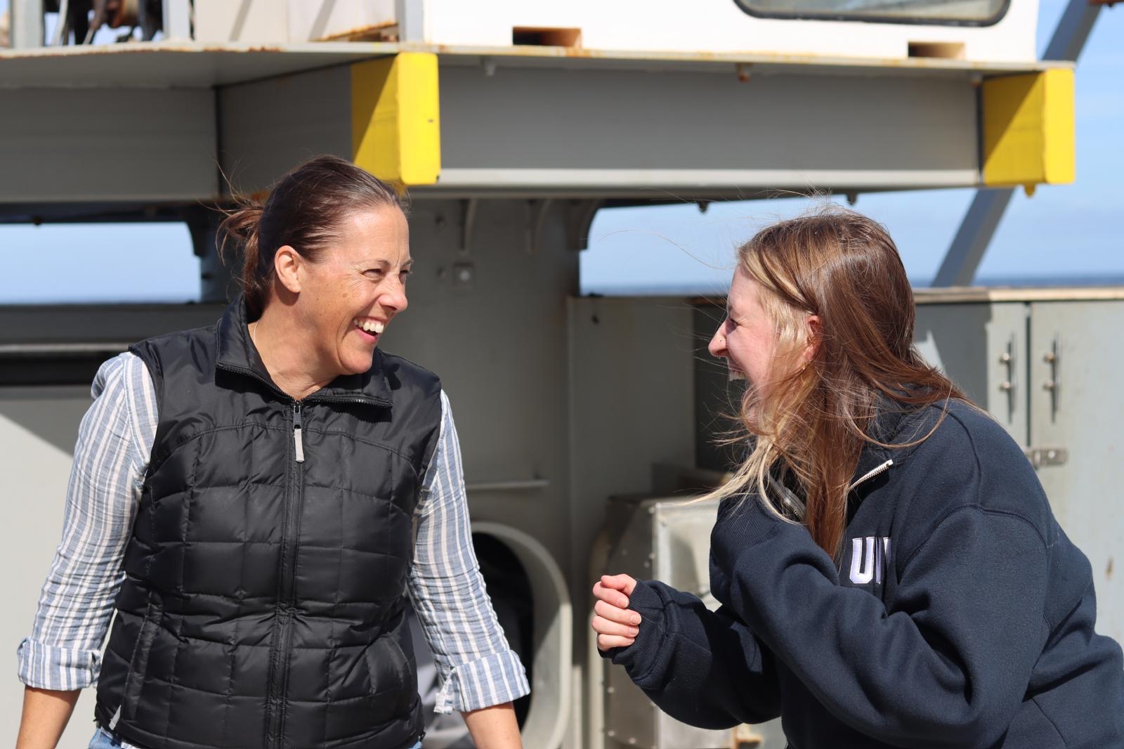 Laughing after post-dive hazing on deck